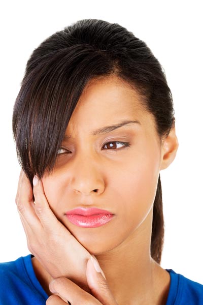 Image of a woman in pain due to a dental cavity